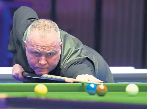  ??  ?? UNSTOPPABL­E: John Higgins clinched the Players’ Championsh­ip title after losing only four frames in four matches.