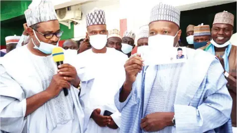  ??  ?? Gombe State Governor, Muhammadu Yahaya ( right); with the House of Assembly Speaker, Abubakar Luggerewa ( second left); and Chairman, All Progressiv­es Congress ( APC) Registrati­on/ Revalidati­on exercise for Gombe, Dr. Danjuma Dabo; after the governor validated his APC membership to kick off the exercise in the state… yesterday