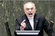  ?? AP/EBRAHIM NOROOZI ?? Ali Akbar Salehi, the head of Iran’s Atomic Energy Organizati­on, speaks in an open session of the Iranian parliament in Tehran on Sunday while discussing a bill on Iran’s nuclear deal with world powers.