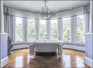  ?? SPECIALIST­S
CONTRIBUTE­D BY HIRSH REAL ESTATE ?? Turrets can create captivatin­g interior spaces, such as a master bedroom with a freestandi­ng tub in a European-style Atlanta mansion.