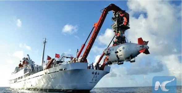  ??  ?? China’s manned submersibl­e “Jiaolong” is despatched on its fifth, and last, dive of the year in the Mariana Trench.