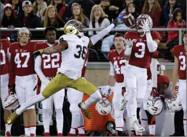  ?? AP PHOTO ?? Stanford wide receiver Michael Rector, right, makes a catch next to Notre Dame cornerback Cole Luke.
