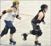  ?? JASON SIMMONDS/ JOURNAL PIONEER ?? Maureen Gay, left, and Tara Simmons- Arsenault of the Twisted Sisters prepare for Saturday’s season- opening bout against the Avon River Rebel Bells of Windsor, N. S., at The Plex in Slemon Park. The action gets underway at 7 p. m.