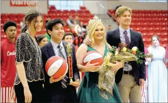  ?? MARK HUMPHREY ENTERPRISE-LEADER ?? Farmington celebrated Colors Day on Friday with a showcase of royalty. (From left): 2018 Colors Day queen Bailee King, daughter of Andy and Lee King, returned to present the king’s trophy to 2019 Colors Day King Evan Ork, son of Andy Ork and Brandi Ork; while 2019 Colors Day queen Jessa Taylor, daughter of Brett and Christy Taylor, was crowned by Farmington student council president Phillip Partain, son of Joe and Dana Partain.