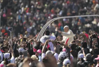  ?? Moises Castillo / Associated Press ?? Pope Francis greets the crowd in Mexico City’s main square, the Zocalo. Francis told church leaders known for their deference to Mexico’s powerful not to hide behind their own privilege.