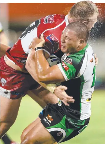  ?? CRUNCH: Blackhawks forward David Munro tackled by Matthew Lodge of Redcliffe last round. ??