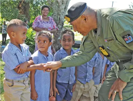  ?? Photo: RFMF ?? Fiji Military Forces Rear Admiral Viliame Naupoto greets students of Sabeto Kindergart­en in Nadi during his three-day visit.