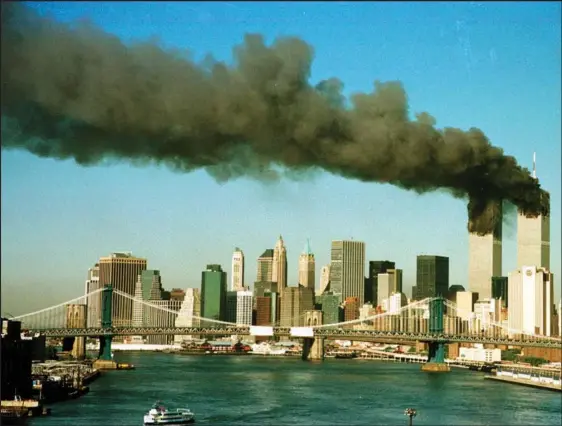  ?? BRAD RICKERBY / REUTERS / FILE PHOTO ?? Smoke billows from the World Trade Center in New York City, shortly after being struck by hijacked commercial airplanes, on Sept 11, 2001.