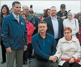  ?? MID-HUDSON NEWS NETWORK PHOTO ?? Jack Bellachio and his mother, Dottie, seated, with Dutchess County Executive Marc Molinaro, left, at Sunday’s ceremony at the Walkway Over the Hudson.