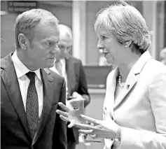  ??  ?? May speaks with Tusk at the Eastern Partnershi­p summit at the European Council Headquarte­rs in Brussels, Belgium. — Reuters photo