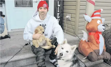  ?? STEPHEN COOKE • THE CHRONICLE HERALD ?? With a new Christmas single The Bells Are Ringing available on streaming services, Enfield rapper Classified (a.k.a. Luke Boyd) looks forward to quality holiday time with his family and their pets, Nova and new pup Winston.