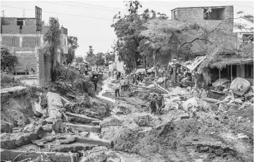  ??  ?? A view of the damage caused by flash floods in Huachipa district, east of Lima. — AFP photo