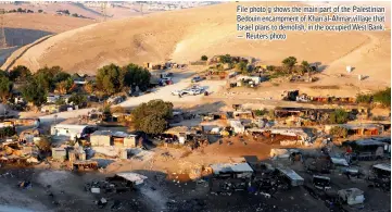  ??  ?? File photo g shows the main part of the Palestinia­n Bedouin encampment of Khan al-Ahmar village that Israel plans to demolish, in the occupied West Bank. — Reuters photo