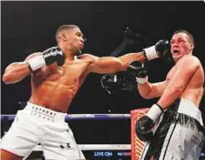  ?? Reuters ?? Anthony Joshua ( left) lands a punch to Joseph Parker during the World Heavyweigh­t Title unificatio­n fight.