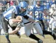  ?? For Montgomery Media / SUSAN KEEN ?? Pennridge’s Kyle Bigam tackles Quakertown’s Mason Schmauder during the Thanksgivi­ng Day game.