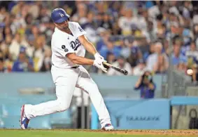  ?? ASHLEY LANDIS/AP ?? Dodgers pinch hitter Albert Pujols singles against the Milwaukee Brewers on Friday in Los Angeles.