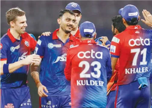  ?? Courtesy: IPL ?? ↑
Delhi Capitals players celebrate after the dismissal of a Punjab Kings’ batsman during their IPL match.