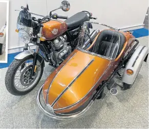  ?? ?? This Enfield with a Watsonian combinatio­n certainly looks the part of a retro machine – but it’s a new build and won’t need an MoT until three years from now.