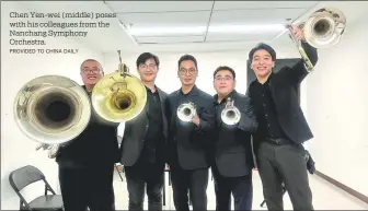  ?? PROVIDED TO CHINA DAILY ?? Chen Yen-wei (middle) poses with his colleagues from the Nanchang Symphony Orchestra.