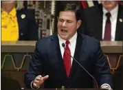  ?? ?? Arizona Republican Gov. Doug Ducey on Thursday signed a massive expansion of the state's private school voucher system. Critics have promised to block the bill.