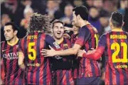  ?? AP PHOTO ?? Lionel Messi (centre) is congratula­ted by teammates after scoring against Almeria at Camp Nou on Sunday.