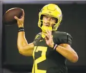  ?? Chris Pietsch Associated Press ?? TYLER SHOUGH has at least 200 yards passing and 80 yards rushing in each of his two games for Oregon.