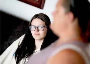  ?? — AFP photos ?? Blanchard, a close friend of Makayla, looks at Shannon, as she speaks during an interview at her home in Virginia Beach, Virginia.