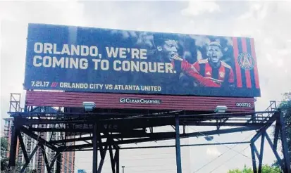  ?? ALICIA DELGALLO/STAFF ?? Atlanta United taunts Orlando City by putting up a billboard in downtown ahead of the teams’ game Friday at Orlando City Stadium.