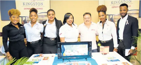  ?? CONTRIBUTE­D PHOTOS ?? Go! Jamaica Travel’s Dave Chin Tung (third right) poses with the VIP Attraction Club Kingston crew at the Go! Jamaica Travel Expo at The Jamaica Pegasus hotel.