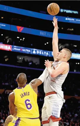  ?? ?? nikola Jokic of denver nuggets shoots the ball over lebron James of los Angeles lakers during the game four of Western Conference Finals on monday (AFP)