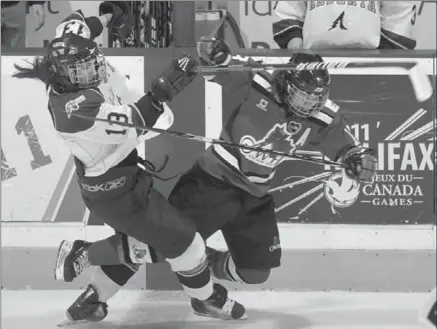  ?? CANADIAN PRESS FILE PHOTO ?? Team Alberta’s Melissa Kueber, left, and Team Ontario’s Erin Ambrose collide during the second period of the women’s hockey gold-medal game at the 2011 Canada Winter Games in Halifax, N.S. Ambrose is one of four new faces on the national team. Players...