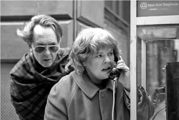  ??  ?? Richard E. Grant and McCarthy in ‘Can You Ever Forgive Me?’ — Courtesy of Fox Searchligh­t