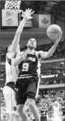  ??  ?? Tony Parker drives against Dirk Nowitzki. Parker’s 30 points helped keep the Spurs atop the Western Conference.