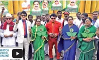  ?? ?? Cadre dressed as MGR and Jayalalith­aa at the venue