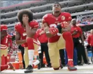  ?? MARCIO JOSE SANCHEZ — THE ASSOCIATED PRESS FILE ?? In this file photo, San Francisco quarterbac­k Colin Kaepernick, left, and safety Eric Reid kneel during the national anthem before an NFL football game against the Dallas Cowboys in Santa Clara Reid says his Christian faith is the reason why he joined...