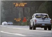  ?? JANE TYSKA — BAY AREA NEWS GROUP VIA AP ?? Traffic flows along Highway 50in South Lake Tahoe. Cal Fire officials downgraded some evacuation orders near Lake Tahoe and allowed thousands of South Lake Tahoe residents who fled the Caldor Fire last week to return home.