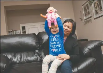  ?? NEWS-SENTINEL PHOTOGRAPH­S BY BEA AHBECK ?? Anastasia Leach, 3, poses for pictures with her mother, Rosa Leach, in their Lodi home on Thursday. Anastasia is in remission from a rare liver cancer.