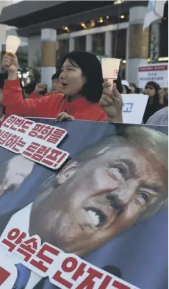  ??  ?? Activists gather in front of the US embassy to demand peace for the Korean peninsula after the cancellati­on of the planned summit