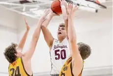  ?? Jim Franco/times Union ?? Stillwater’s Jaxon Mueller goes up between two Canton defenders on Friday. Mueller had 26 points.