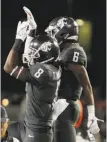  ?? Young Kwak / Associated Press ?? Washington State wide receiver Tavares Martin Jr. (8) celebrates his touchdown catch against USC.