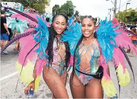  ??  ?? Mellissa Johnson (left) and Shanica Nairne fêted their hearts out during last year’s road march.