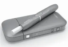  ?? PHILIP MORRIS ?? Philip Morris’s iQOS device heats tobacco sticks, but stops short of burning them, an approach that the company says reduces exposure to tar and other toxic byproducts of burning cigarettes.