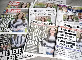  ?? ?? A picture shows the front pages of some of Britain’s national newspapers, dominated by stories about Catherine announcing her cancer diagnosis, in Amersham.