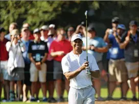  ?? PATRICK SMITH / GETTY IMAGES ?? Tiger Woods is one of 20 players at the Masters who have won a green jacket. He’ll look to add to his collection this weekend in Augusta, Ga.