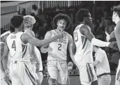  ?? Tim Aylen / Associated Press ?? Kendall Brown (2) and his Baylor teammates congratula­te themselves for handling Arizona State.