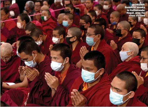  ?? Picture: NARENDRA SHRESTHA/EPA ?? WORSHIP: Buddhist monks in Kathmandu, Nepal, pray for virus victims