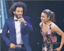  ?? AP ?? Brazil's Marta (right) with compatriot and Real defender Marcelo, who was named in the World XI, after she received the Best FIFA Women's player award for a record sixth time.