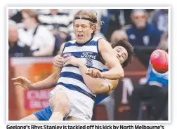  ?? Picture: Michael Klein ?? Geelong’s Rhys Stanley is tackled off his kick by North Melbourne’s Eddie Ford on Sunday.