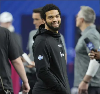  ?? MICHAEL CONROY — THE ASSOCIATED PRESS ?? USC quarterbac­k Caleb Williams, watching players run a drill at the NFL scouting combine, opted out of medical exams at Indianapol­is.