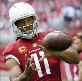  ?? RICK SCUTERI — THE ASSOCIATED PRESS FILE ?? Arizona wide receiver Larry Fitzgerald warms up prior to a game in Glendale, Ariz. New Arizona coach Steve Wilks says Fitzgerald has said Fitzgerald will return for a 15th season.